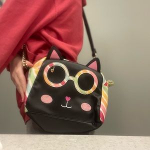 Betsy Johnson purse colors are pink, white, orange, yellow, green and  black